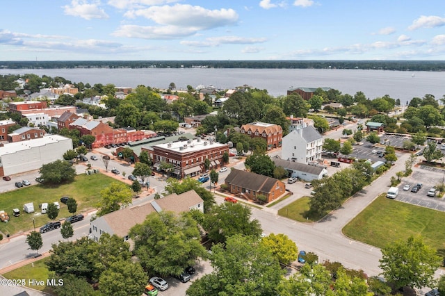 birds eye view of property with a water view and a residential view