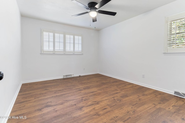 unfurnished room featuring ceiling fan and dark hardwood / wood-style floors