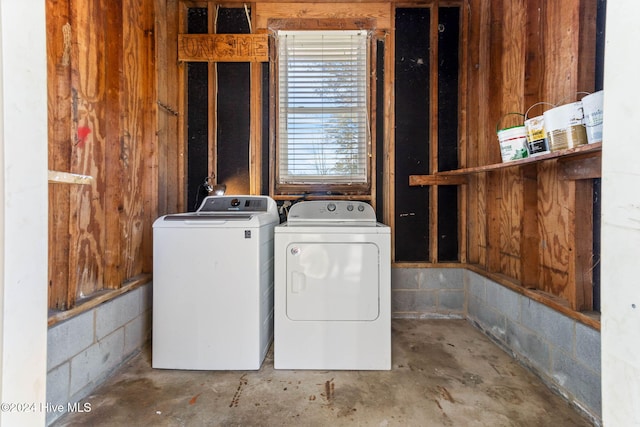 clothes washing area with washing machine and clothes dryer