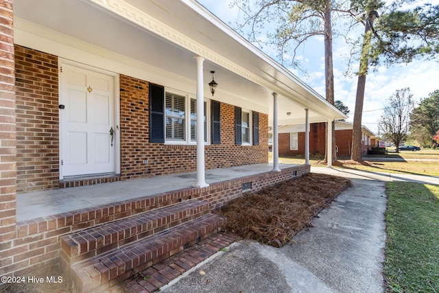 doorway to property with a porch