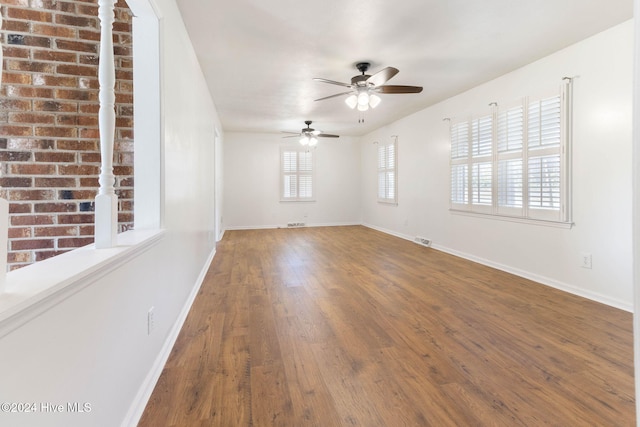 empty room featuring ceiling fan and wood-type flooring