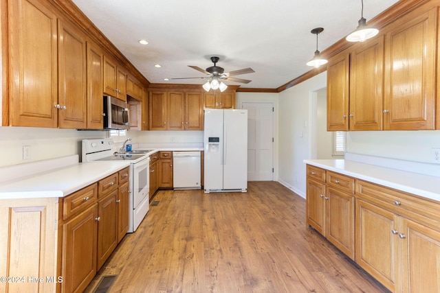 kitchen with white appliances, ceiling fan, crown molding, decorative light fixtures, and light hardwood / wood-style flooring