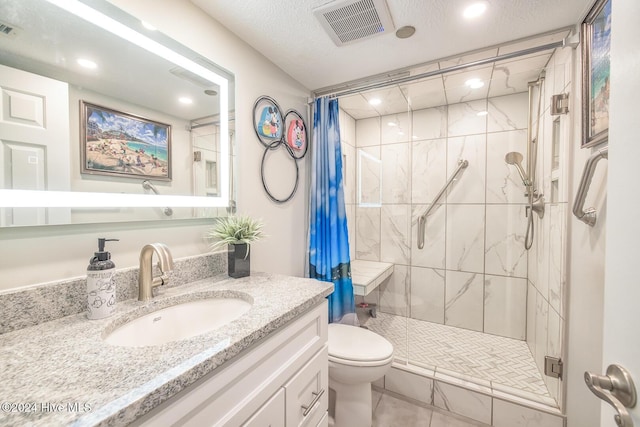 bathroom with curtained shower, tile patterned floors, a textured ceiling, toilet, and vanity