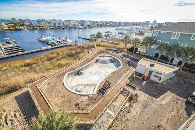 birds eye view of property featuring a water view