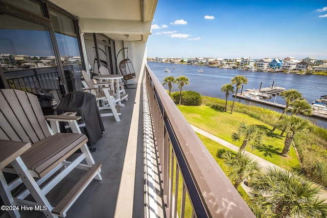 balcony featuring a water view