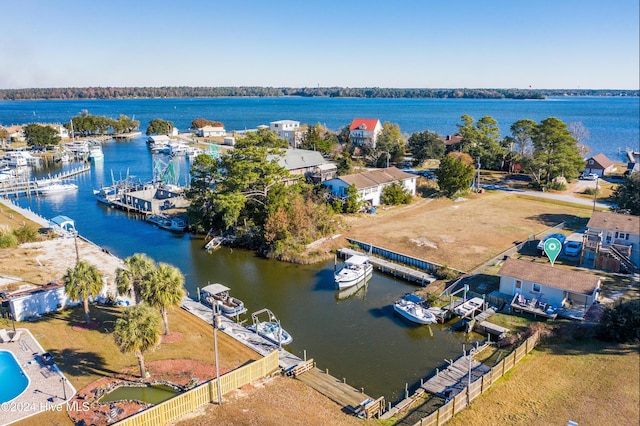 birds eye view of property featuring a water view