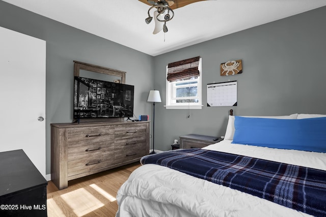 bedroom featuring ceiling fan and light hardwood / wood-style floors