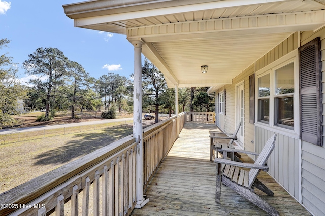 wooden terrace with a porch