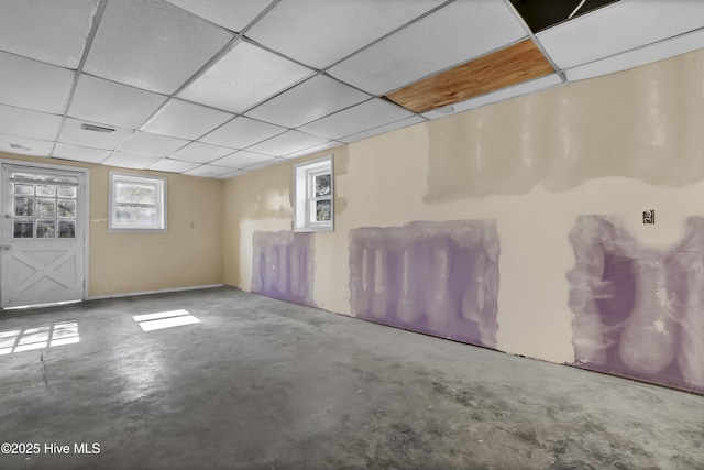 basement featuring a paneled ceiling