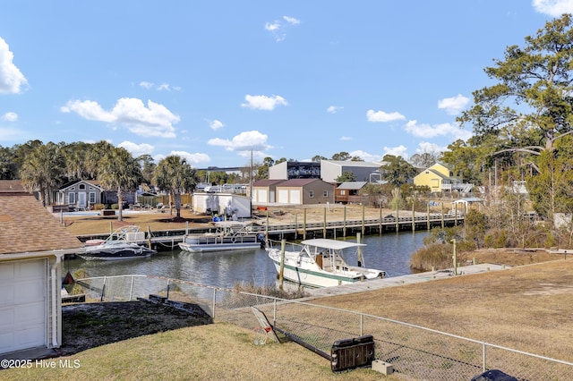 dock area featuring a water view and a lawn