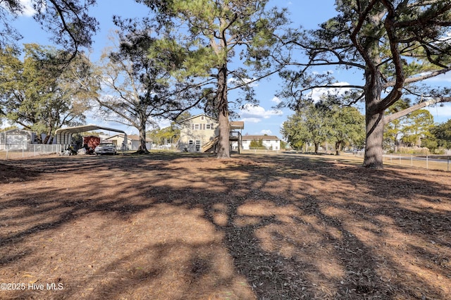 view of yard featuring a carport