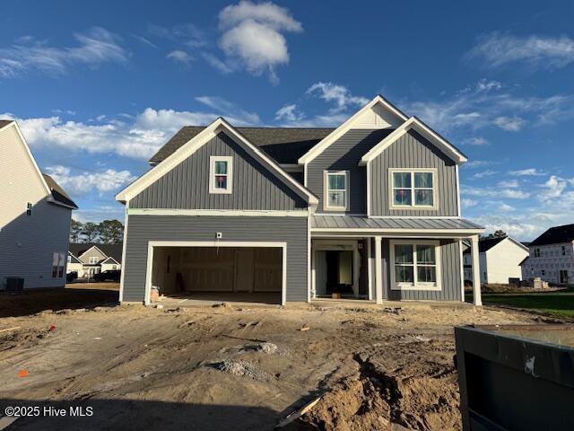 view of front of home featuring a garage and covered porch