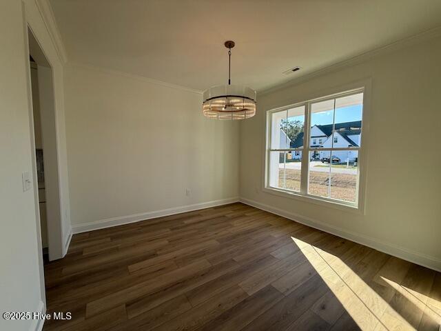 kitchen with white cabinetry and crown molding