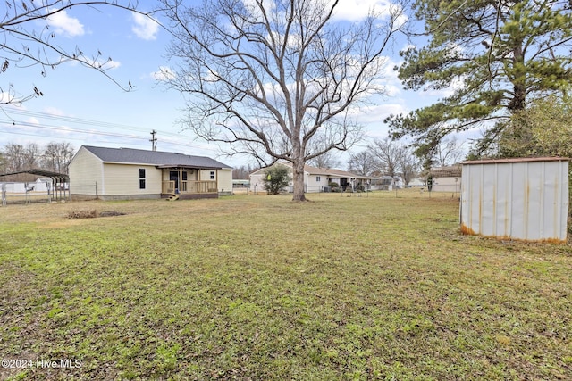 view of yard with a storage shed