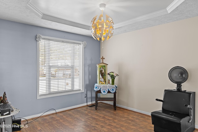 living area featuring a notable chandelier, dark hardwood / wood-style floors, a healthy amount of sunlight, and a tray ceiling