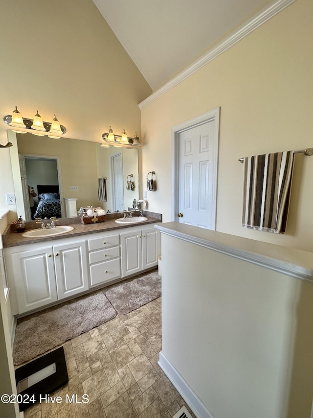 bathroom featuring vanity and vaulted ceiling