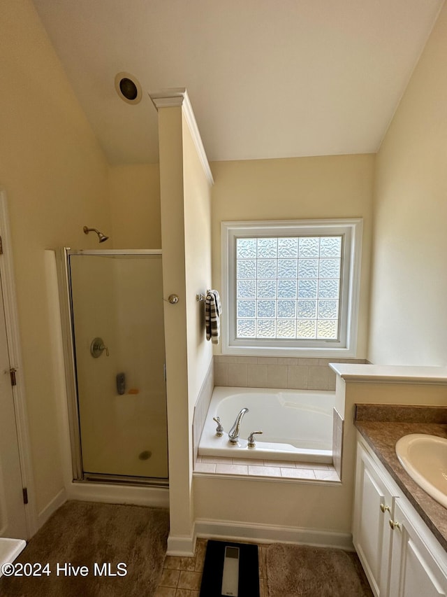 bathroom featuring vanity and separate shower and tub