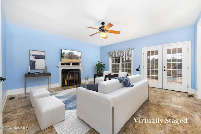 living room with ceiling fan and french doors