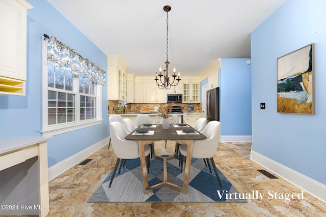 dining area featuring a chandelier