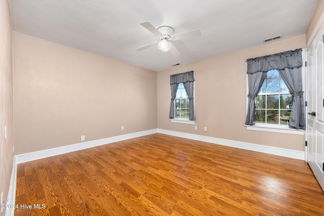 spare room featuring ceiling fan and wood-type flooring