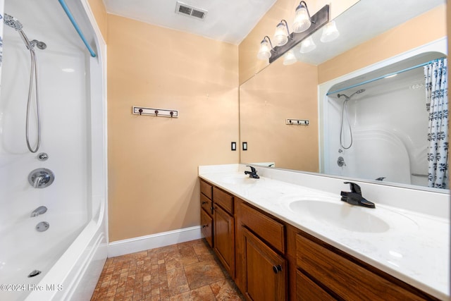 bathroom featuring vanity and shower / bath combination with curtain