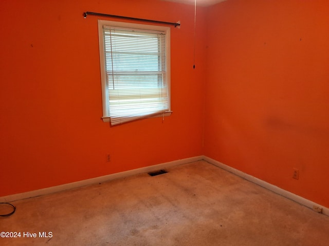 empty room featuring carpet floors