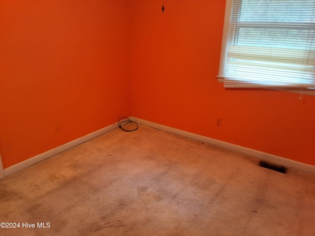 spare room with carpet floors