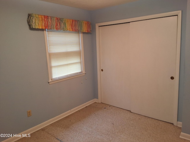 unfurnished bedroom with a closet