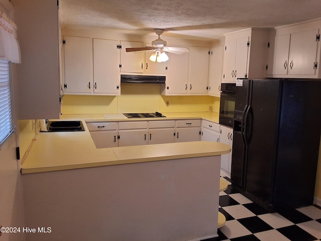 kitchen featuring black appliances, white cabinets, kitchen peninsula, and sink