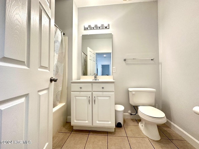 full bathroom with tile patterned flooring, vanity, shower / bath combination with curtain, and toilet