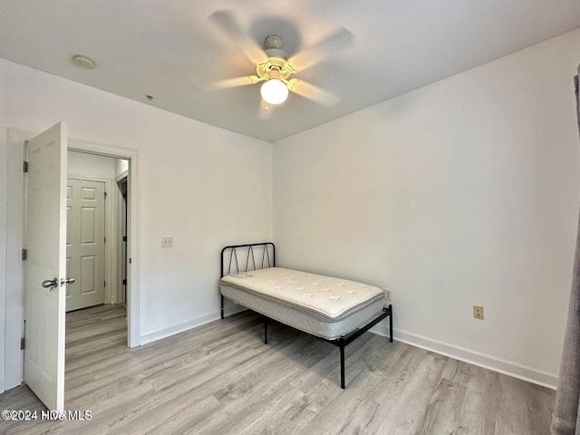 bedroom featuring ceiling fan and light wood-type flooring