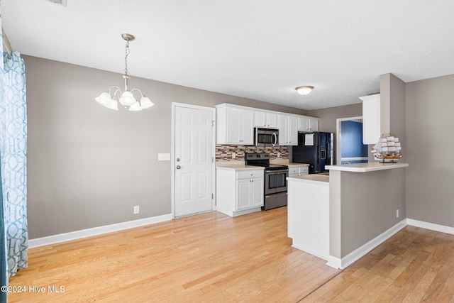 kitchen featuring white cabinets, appliances with stainless steel finishes, kitchen peninsula, and light hardwood / wood-style flooring