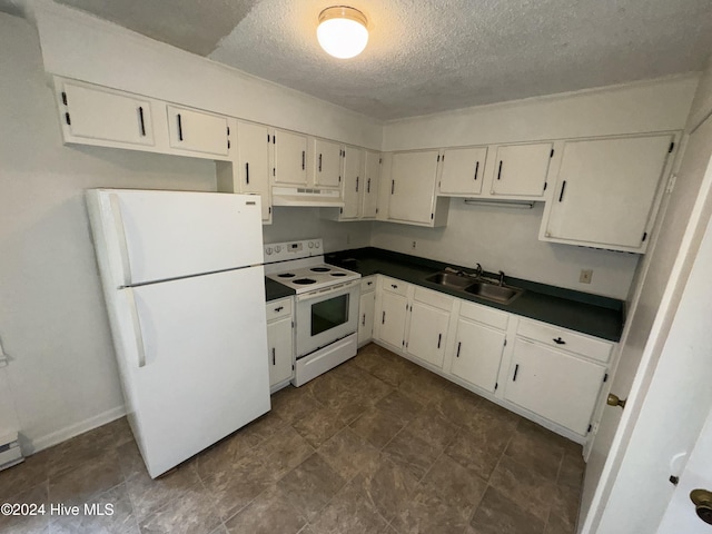 kitchen with white cabinets, a textured ceiling, white appliances, and sink