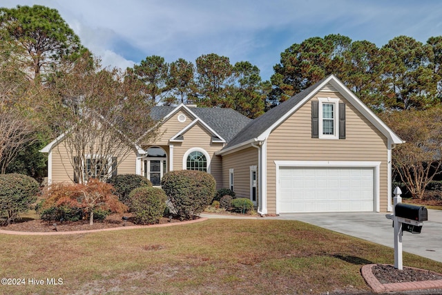 front of property featuring a garage and a front lawn