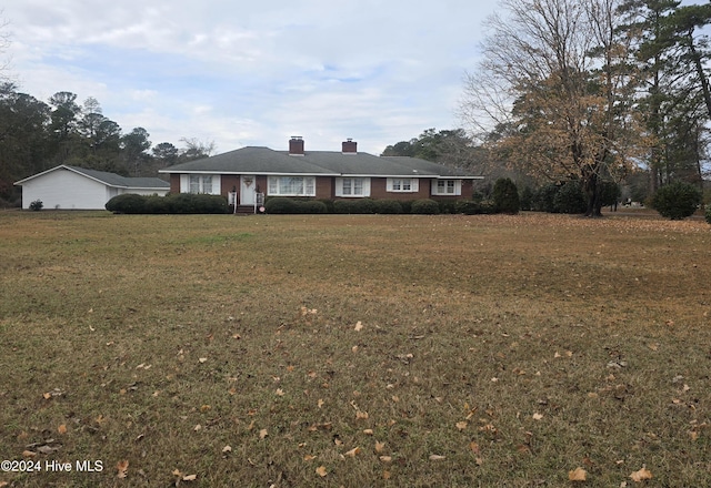 ranch-style house with a front lawn