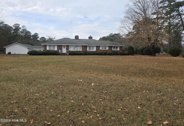 1003 S Main St, Bladenboro, NC 28320 - ranch-style house with a chimney and a front yard