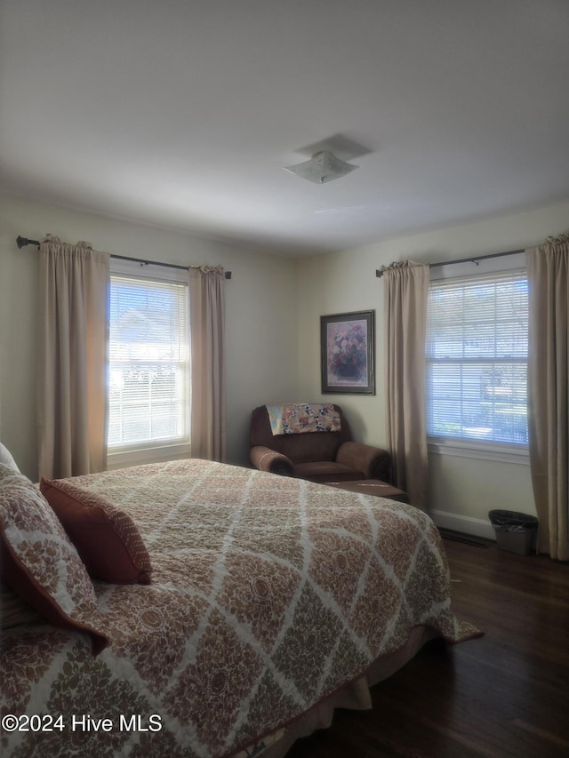 bedroom featuring dark hardwood / wood-style flooring