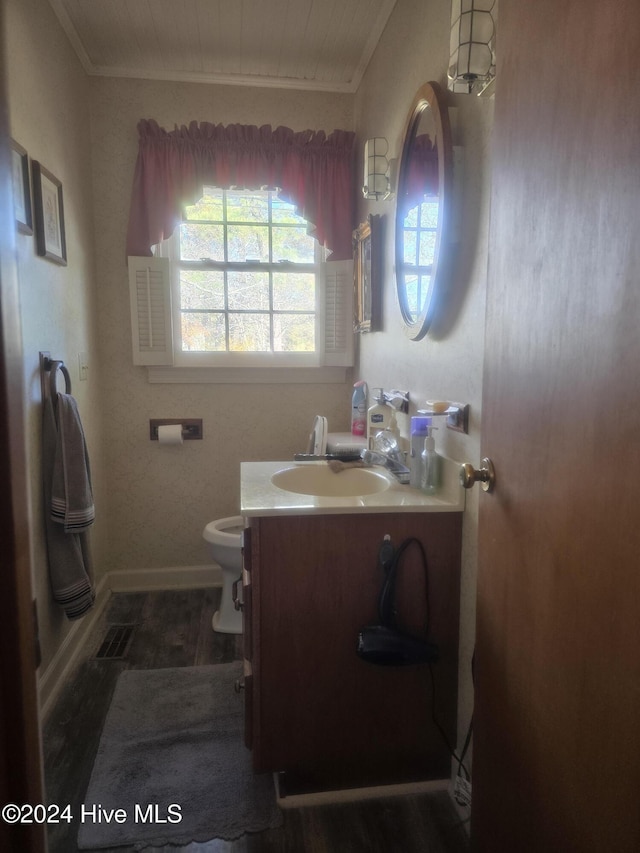 bathroom featuring wooden ceiling, crown molding, hardwood / wood-style floors, toilet, and vanity