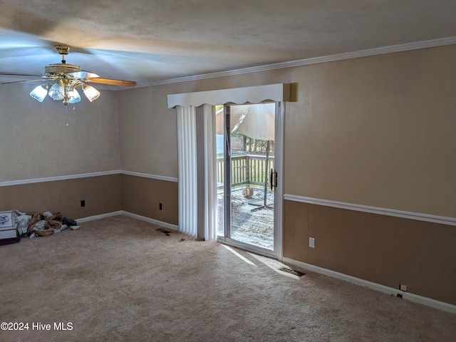 carpeted empty room with crown molding, ceiling fan, and a textured ceiling