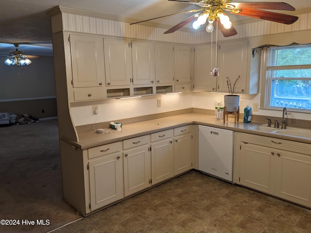 kitchen featuring white dishwasher, white cabinetry, and sink