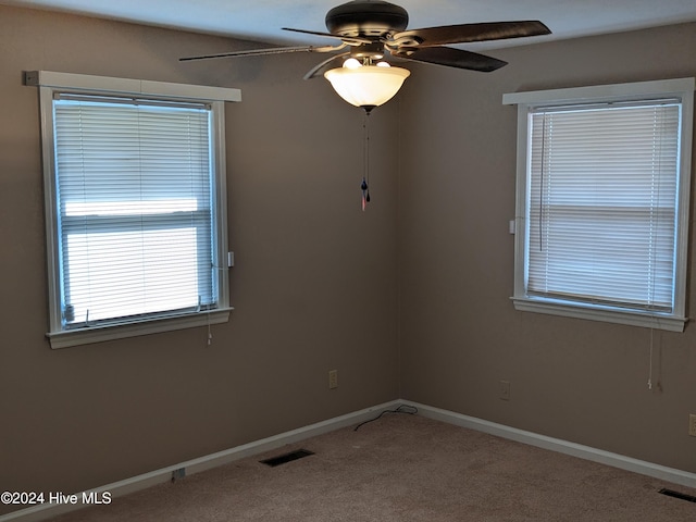 empty room with carpet and ceiling fan