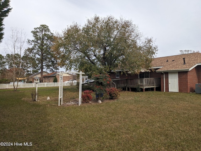 view of yard featuring a wooden deck