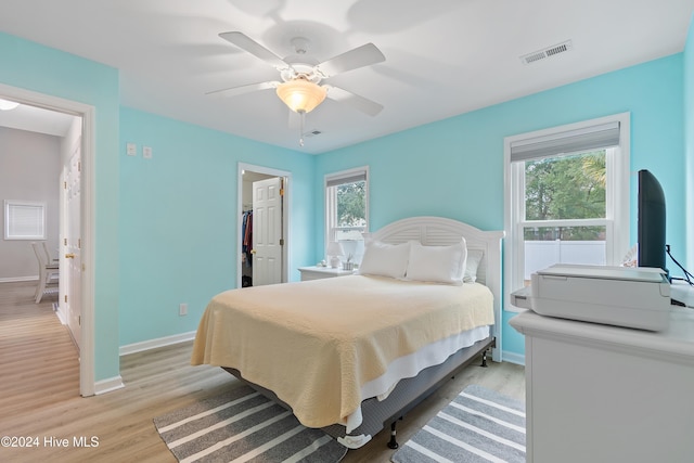 bedroom featuring light wood-type flooring and ceiling fan