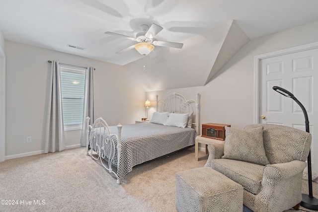 bedroom featuring ceiling fan, light carpet, and lofted ceiling