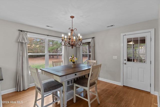 dining room featuring a chandelier and hardwood / wood-style floors