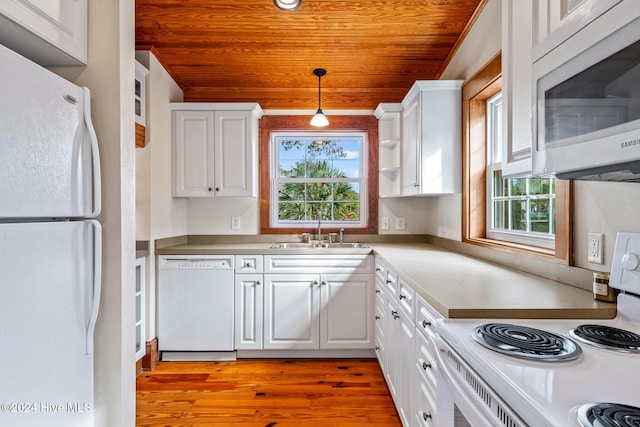 kitchen with sink, white appliances, white cabinets, decorative light fixtures, and wooden ceiling