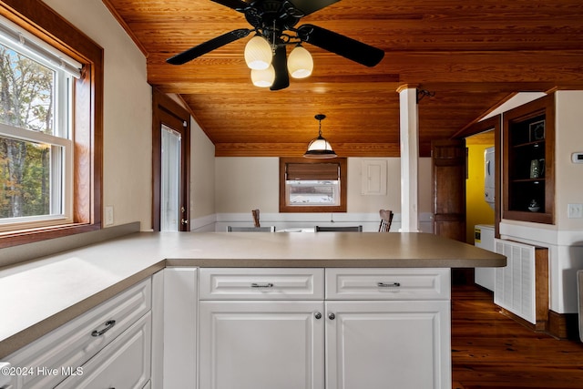 kitchen with pendant lighting, white cabinetry, kitchen peninsula, and wooden ceiling