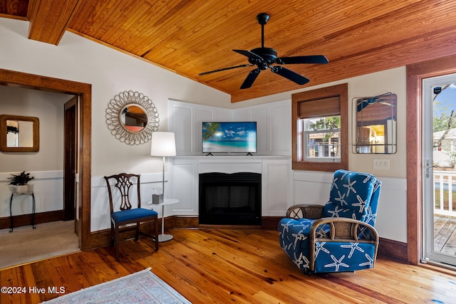 sitting room with wood ceiling, ceiling fan, vaulted ceiling, and hardwood / wood-style floors