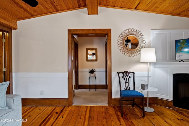 unfurnished room featuring lofted ceiling, hardwood / wood-style flooring, and wooden ceiling