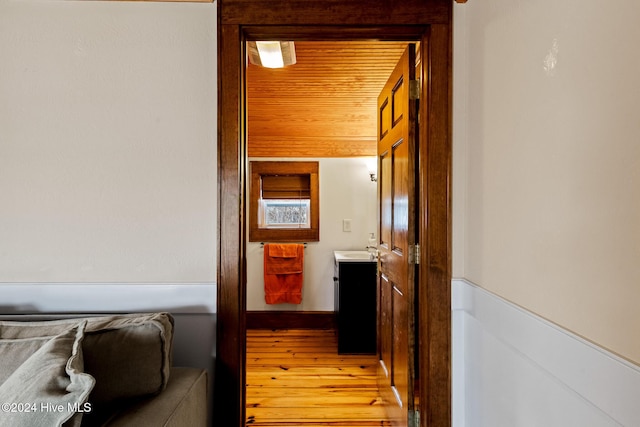 hall featuring sink and light hardwood / wood-style flooring